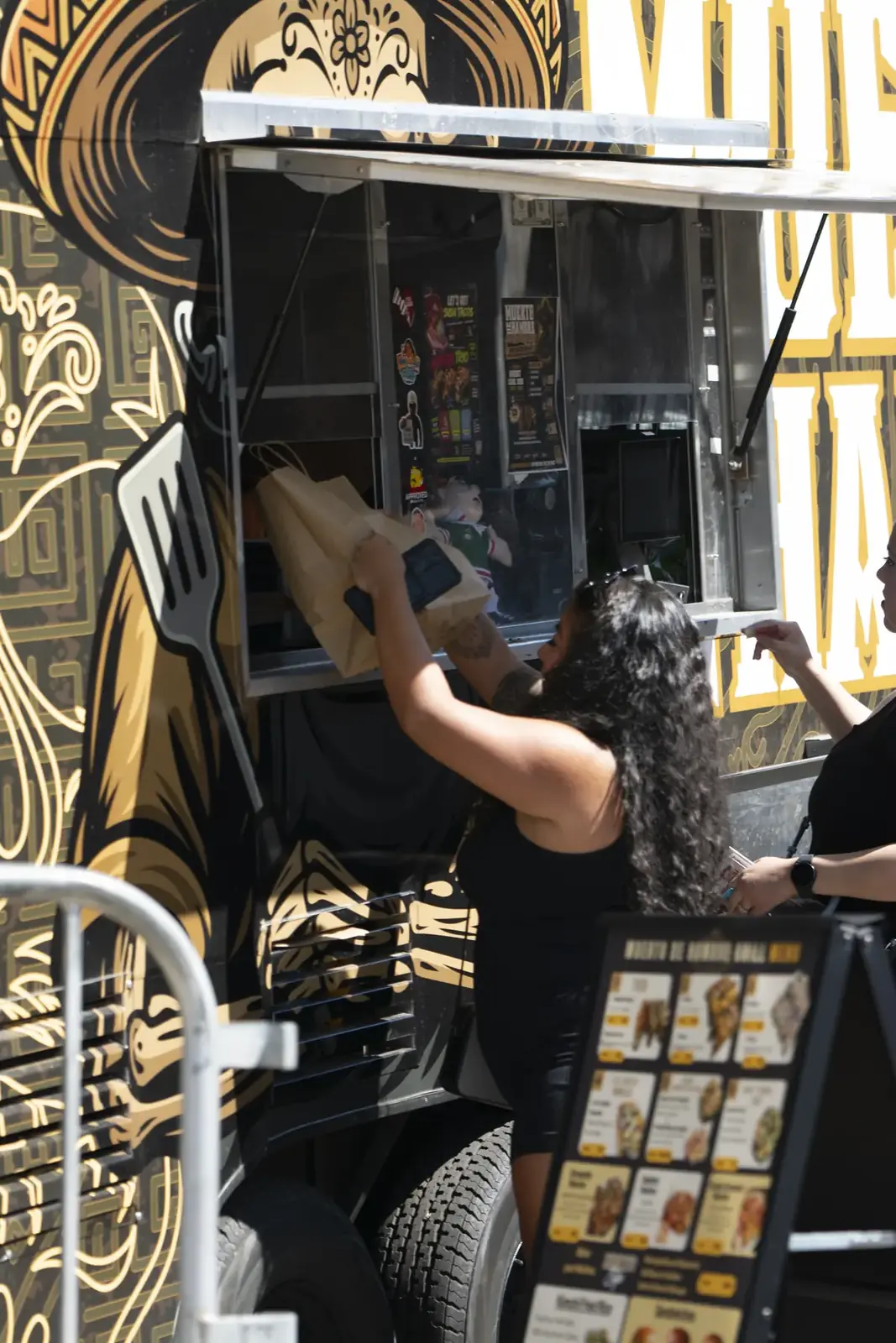Serving from the Muerto De Hambre food truck